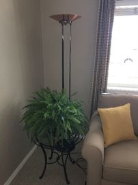 Side table, faux fern and tall lamp.