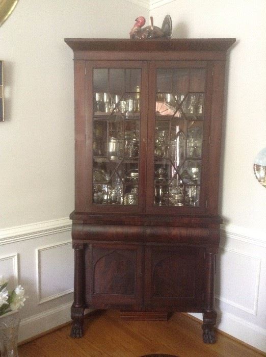 Antique corner cabinet with claw feet. 