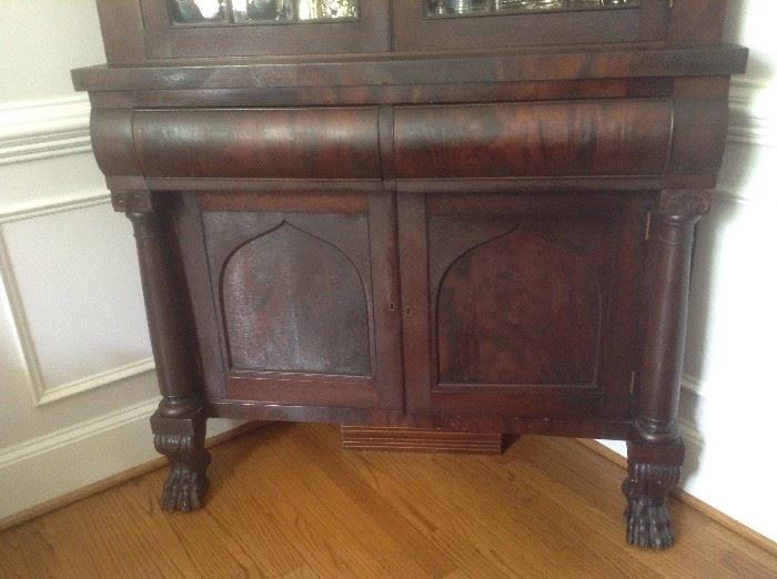 Close up of claw feet. Two doors on bottom open for storage. Two drawers in center and 3 shelves up top. 1870's circa.