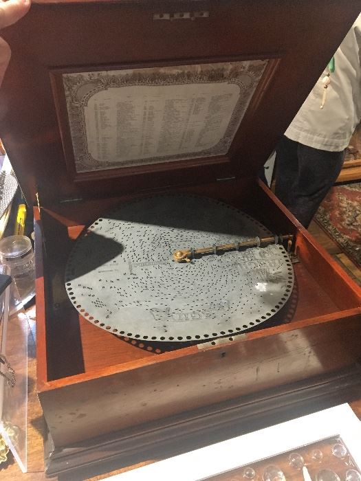 Rare Antique Regina Music box in beautiful Original Mahogany Case with 15 original music discs, Circa. 1890's, work's perfectly.  Exquisite Piece!!