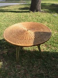 Woven patio table.  Vintage with folding legs