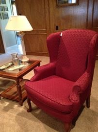 Red upholstered wing back chair; side table matches the coffee table & sofa table