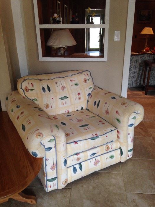 Garden room chair has matching room divider and sofa.