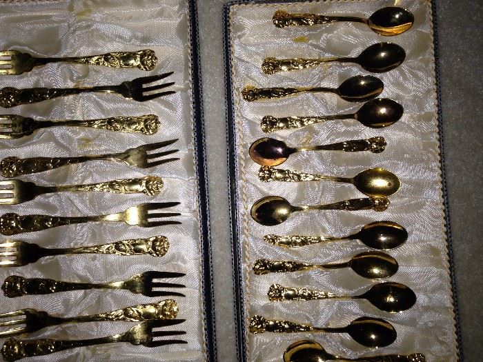 Gold colored dessert forks and spoons