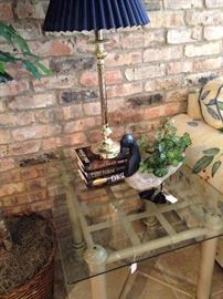 The glass top side table has a matching coffee table.