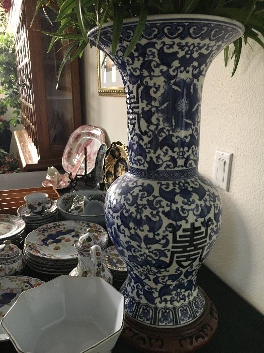 24" tall Asian vase with stand. 
