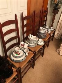 A set of six ladder back chairs with woven seats.. Each chair holds a different set of China for your table.