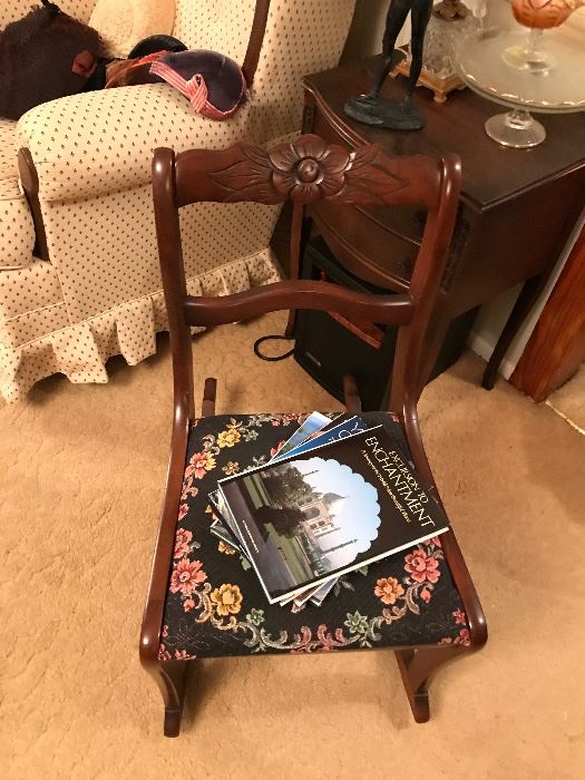 Beautiful small mahogany rocker with new tapestry seat. Carved floral design. More of the many books throughout the house and all reasonably priced.
