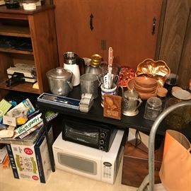 Kitchen gadgets. Microwave. Wooden bowls. 