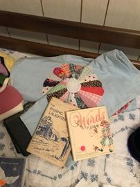 Quilt tops and vintage children's books.