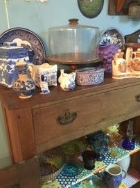 The kitchen is exploding with great items-cake plates and Blue Willow.