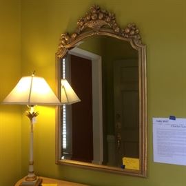 ornate gold frame wall mirror and table lamp