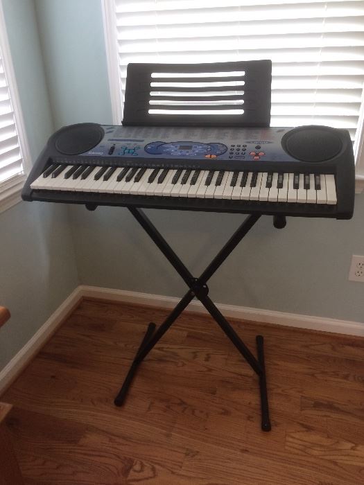 Casio keyboard (model LK490) with stand