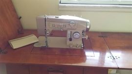 WHITE SEWING MACHINE IN CABINET