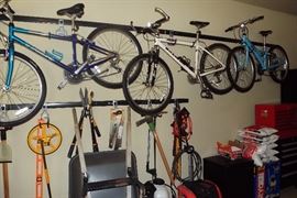 Raleigh bike, blue bike, pruning shears, pick axe, wheel barrow