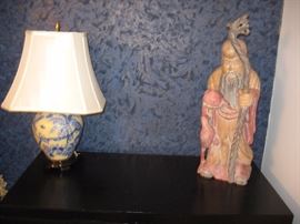Carved wood Chinese elder with dragon head staff. Yellow and blue lamp