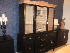 Good looking lighted china/display cabinet with side cabinets painted black.