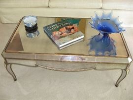 Smoked glass and mirrored coffee table with blown glass piece and a china Tiffany Co. bowl
