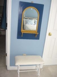 Mirror with shelf and blue suround.  Heavy wrought iron vanity bench