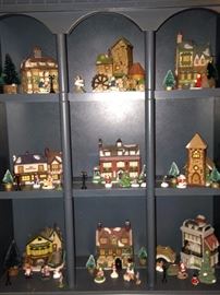 Display cabinet with miniature Christmas scenes