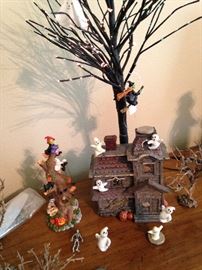 Haunted house and lighted tree