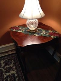 Small side table; crystal lamp; beaded Christmas runner