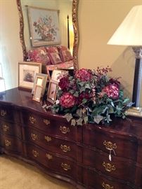 Lovely triple dresser; one of many floral arrangements