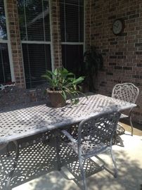 Large patio table has 6 chairs