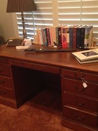 Desk; books; lamp; WW II machete