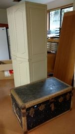 Plastic cabinet and vintage trunk. 