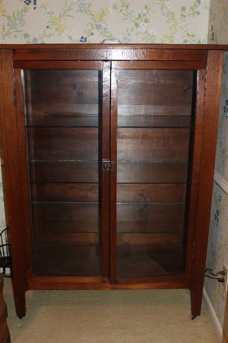 Double door; glass front display cabinet. (Dimensions: 3' wide, 4'8" tall and 17.5 inches in depth.)