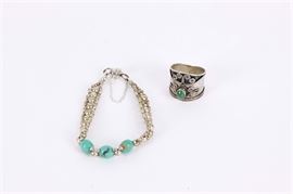 Sterling Silver Jewelry Group: A sterling silver jewelry group. The group features a size seven sterling silver malachite band ring with a reliefed scrolled design, marked 925 to the interior of band. Also included is a sterling silver turquoise bracelet that features woven circular beads with three turquoise stones and a magnetic clasp. Total weight .3475 ozt.