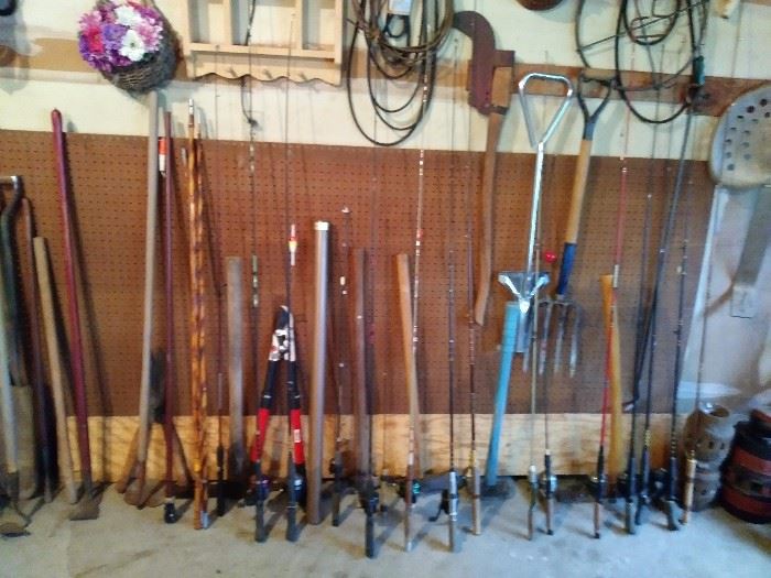 Several fishing rods and hand tools