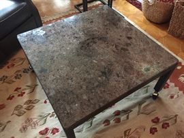Room And Board granite top table on casters