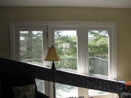 Beautiful view out of the living room window onto the porch - greenery everywhere