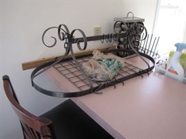 You can hang this traditionally with pots or you can add other pictures, etc. within the pots to make it more interesting