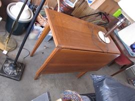 A gem in the garage amongst regular garage stuff. That table with extension you have always needed