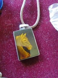 Carved amber w/ Sterling bezel 