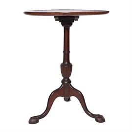 Vintage Queen Anne Style Cherry Pedestal Table: A vintage Queen Anne style cherry pedestal table. This round top piece features a central carved fan motif rising on a turned pedestal base with curved legs terminating on claw and ball feet. There are no visible maker’s marks or labels on this piece.