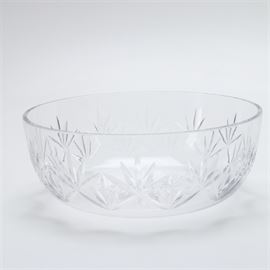 Crystal Serving Bowl: A crystal serving bowl. This piece features a wide base and shallow bowl with fan cuts to the sides and a star cut to the center of the base. The piece is unmarked.