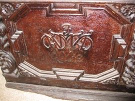 Initials on ornate trunk