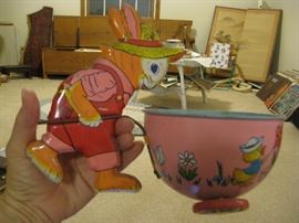 Rabbit pushing a barrel on wheels