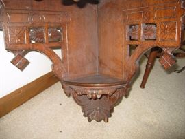Ornate corner shelf carved base and sides