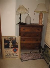 Poster, lamps and vintage chest of drawers