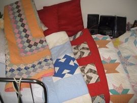 Various piecework quilts