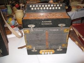 M Hohner accordion with wood speaker.  This one is in great condition!