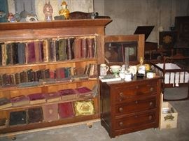 Vintage solid wood bookcase (no base) with numerous Victorian photo albums large and small.  Tons of history here!