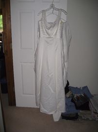 Size 6 sleeveless/beaded neckline wedding dress with train.  Bodice has 1" pleated accent with a slight flair to the skirt