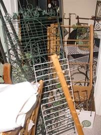 a room FULL of metal display items, plant stands, shelving units, and more