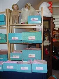 Madame Alexander dolls in boxes, plus the two on top shelf are old, 60's MA dolls too